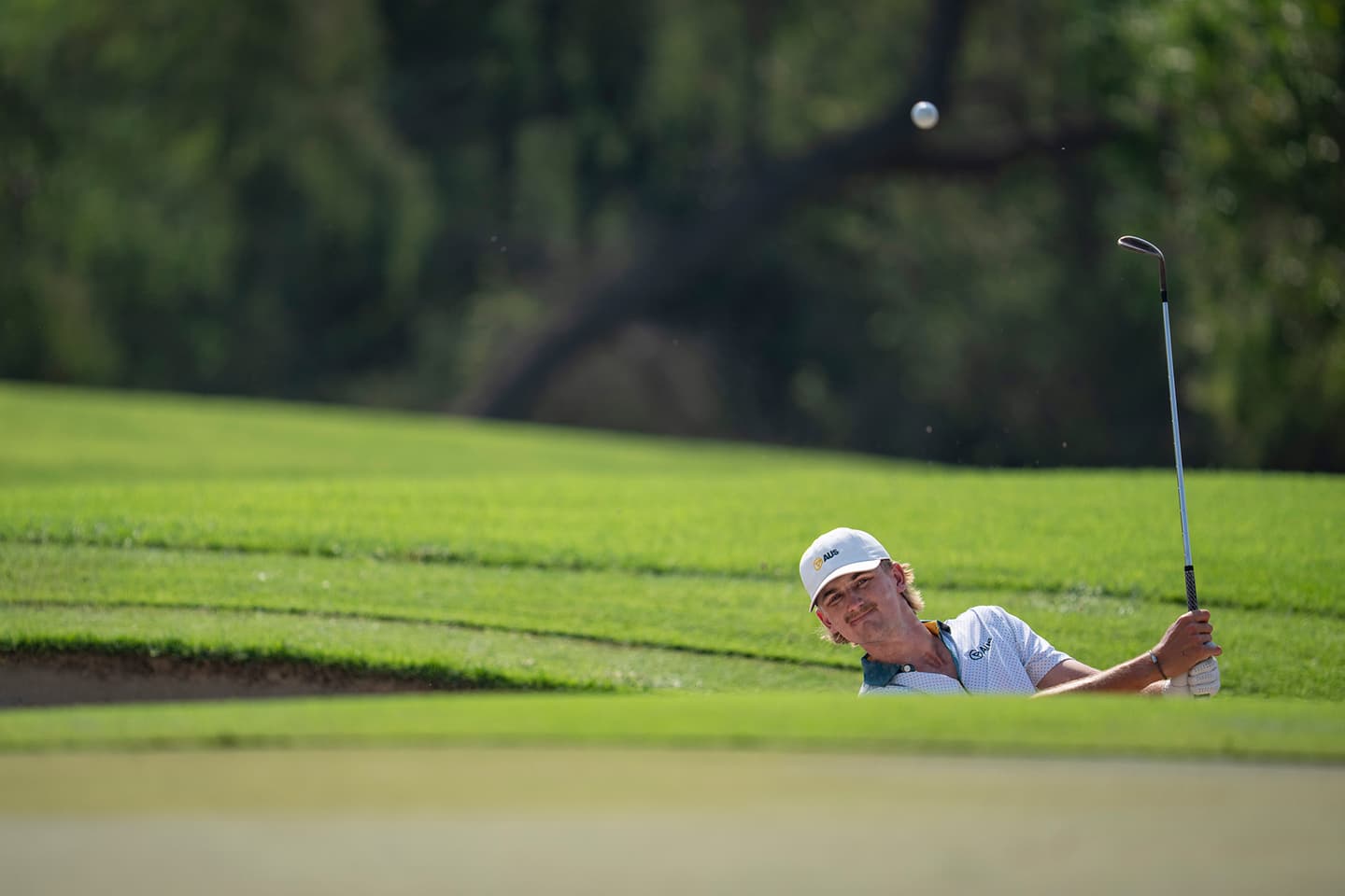 Harry Takis of Australia chips to the green