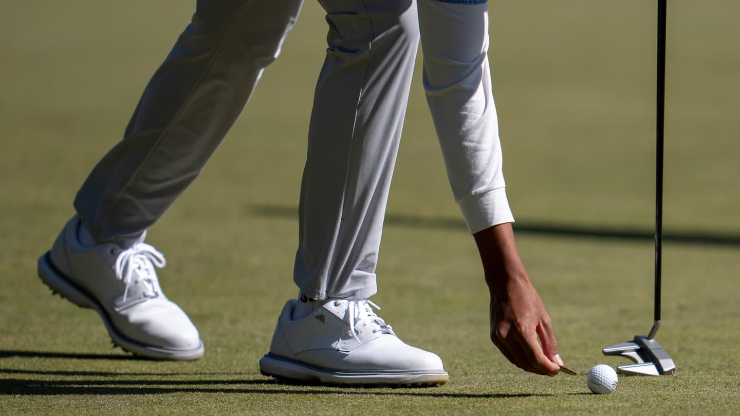 Detail as Fifa Laopakdee of Thailand marks his ball on the green during the second round of the 2026 Asia-Pacific Amateur Championship